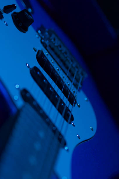 istock electric guitar close up illuminated by blue light 1354734980
