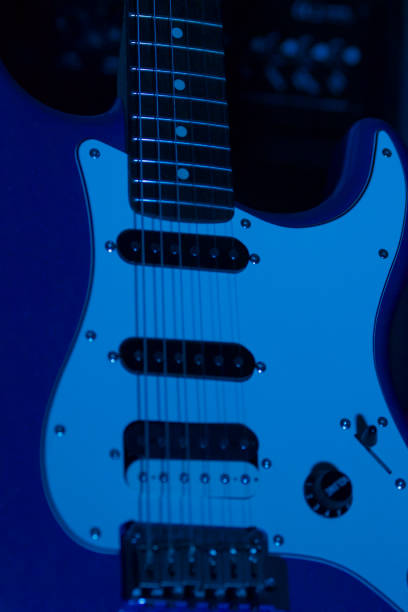 istock electric guitar close up illuminated by blue light 1354734992