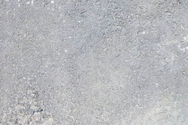 istock The texture of dark old worn asphalt 1354736055