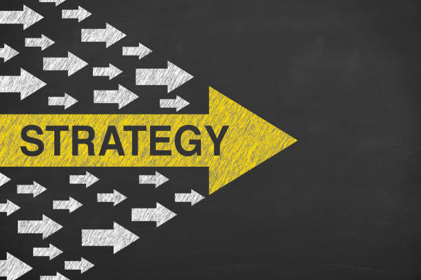 Express using arrows. Strategy brings success. Business man is drawing on chalkboard.