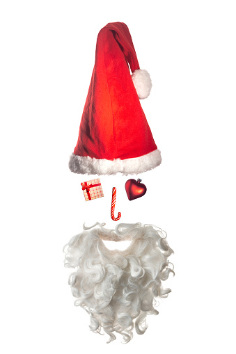Phot of Santa Claus head shape made of Christmas symbols such as Santa Hat, gift box, heart shape, stick candy, and white long beard. Isolated on white. Shot with a full frame mirrorless camera.