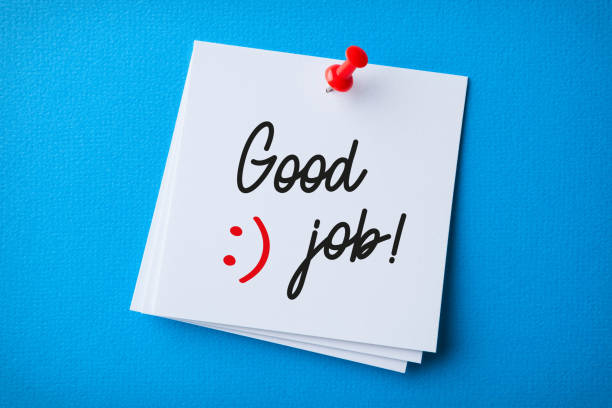 istock White Sticky Note With Good Job And Red Push Pin On Blue Background 1354737984