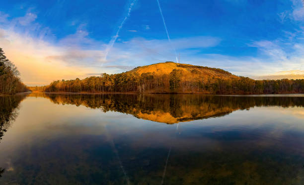 Stone mountain in the morning will a perfect reflection in venerable lake stock photo
