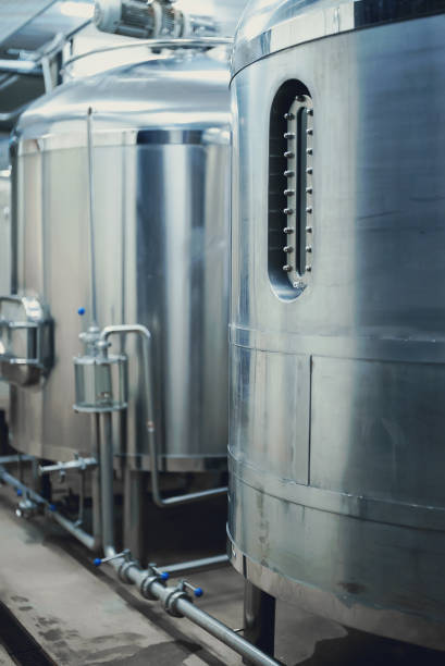 istock Modern brewery factory interior with reservoirs. 1354741614