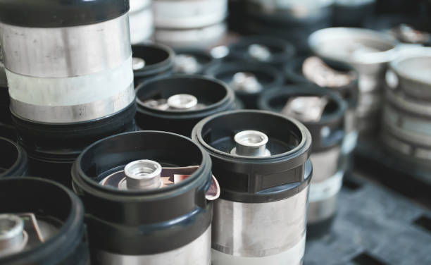 istock Many metal beer kegs in storage. 1354741625