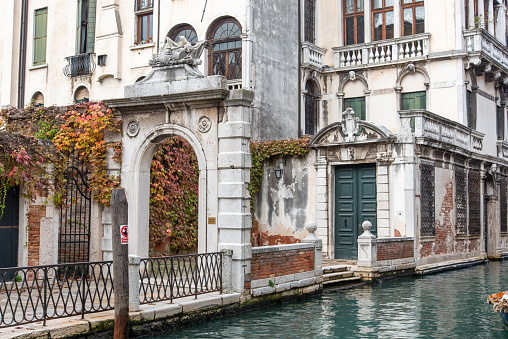 Entrance of an old baroque Palace in Dorsoduro Quarter, Venice, Italy