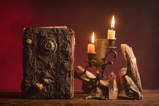 Book of magic on the table background. Witchcraft concept.