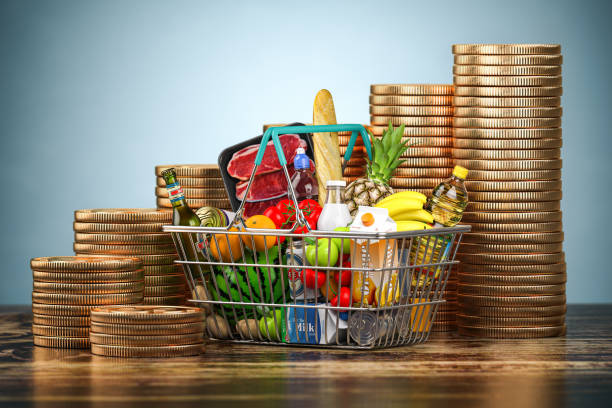 nflation, growth of food sales or growth of market basket or consumer price index concept. shopping basket with foods and coin stacks. - munt culinair illustraties stockfoto's en -beelden