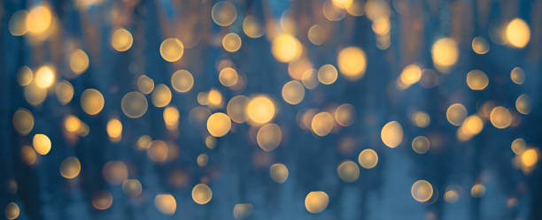 istock Blurred blue texture background with golden bokeh 1354749746
