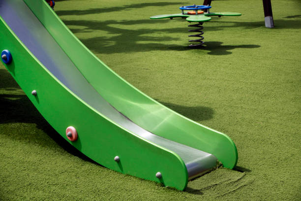 istock Metal green sledge, children playground. 1354751920