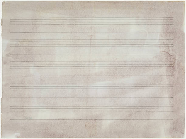 istock Old sheet music without music notes, isolated on white 1354752030
