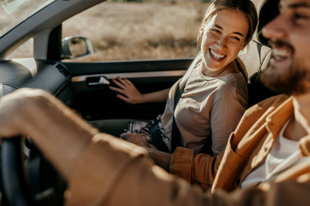 istock Couple having fun on car road trip 1354752700