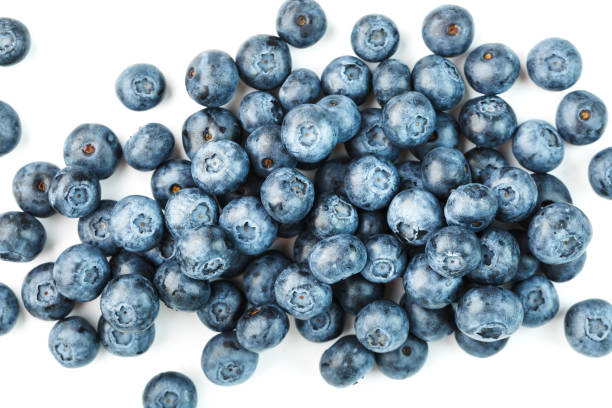 istock Tasty blueberries fruit are scattered on a white background. 1354753013
