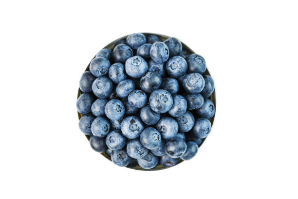 istock Juicy and ripe Blueberries in a white plate on a white background 1354754277