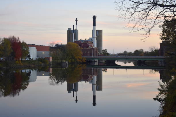 istock Industrial city symmetric water reflection 1354756458