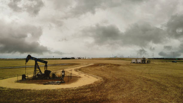 Crude Oil Pump and Midwest Agricultural Aerial View During Early Spring Storm 4K Video Near Interstate 70 in Kansas Oil Fields Infrastructure Energy Outdoor Environment Matching 4K Video Available (Photos professionally retouched - Lightroom / Photoshop - downsampled as needed for clarity and select focus used for dramatic effect)