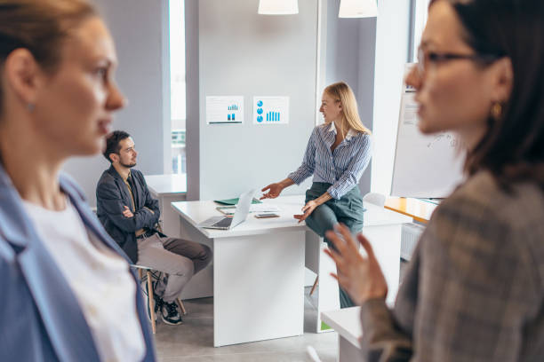 istock Business people in the office talk informally 1354759378