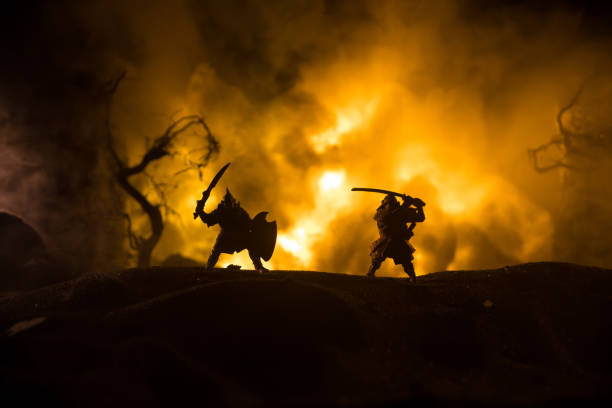 Medieval battle scene with cavalry and infantry. Silhouettes of figures as separate objects, fight between warriors on dark toned foggy background with medieval castle.
