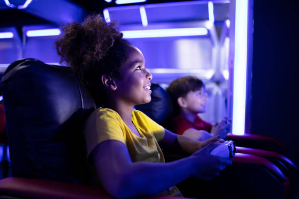 istock Entertaining industry and children playing video games. 1354760408
