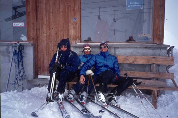 winter sports enthusiasts are waiting for better weather conditions for the ski descent - group of people 1980s style image created 1980s exercising imagens e fotografias de stock