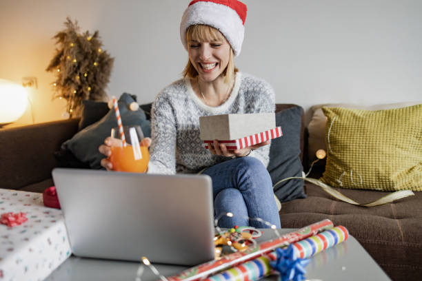 istock Woman having online Christmas celebration at home 1354762809