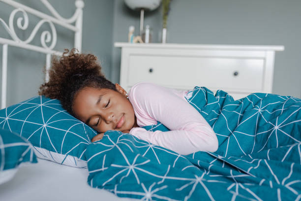 istock A little girl is sleeping in bed 1354766168