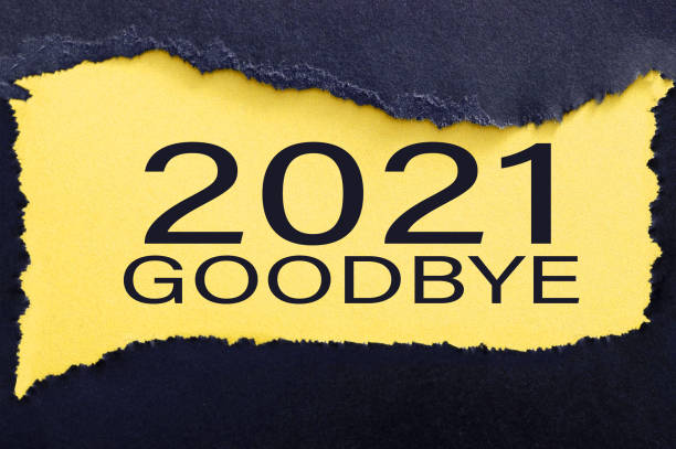 istock Happy new year 2022 Goodbye 2021 torn paper background 1354767886