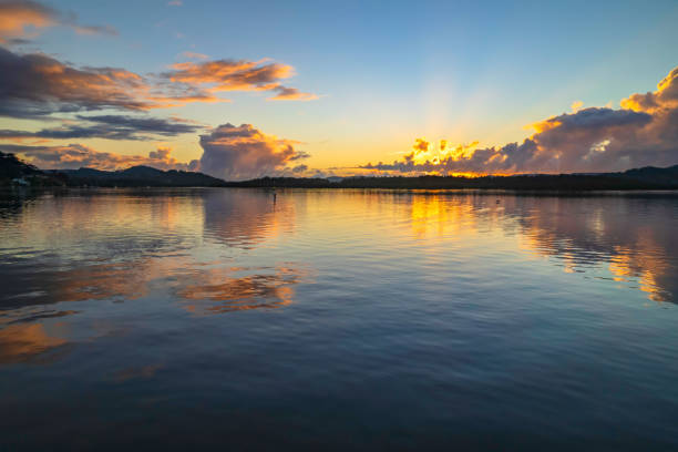 istock Aerial sunrise over the bay with clouds and reflections 1354767948