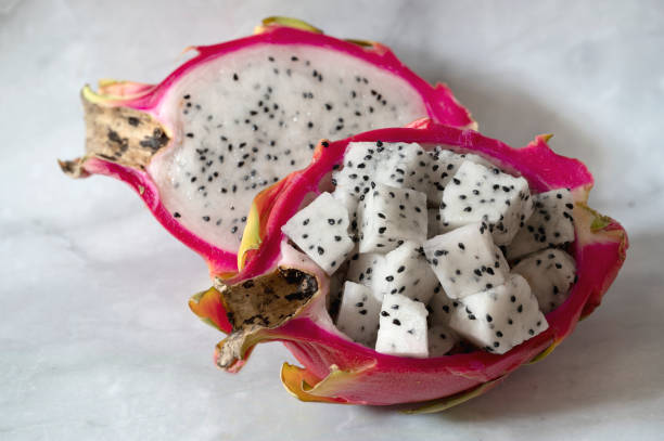 istock Halfs of pitaya or dragon fruit with cut into pieces fruit pulp 1354770177
