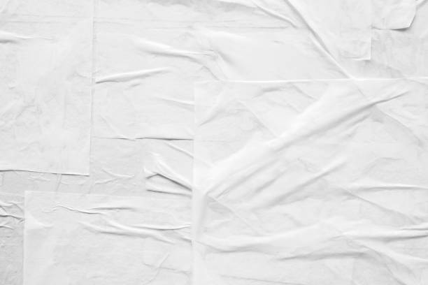 istock Blank white crumpled and creased paper poster texture 1354774955