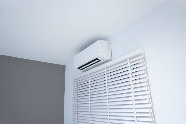 istock Air conditioner and adjusting vertical or venetian blinds. 1354777398