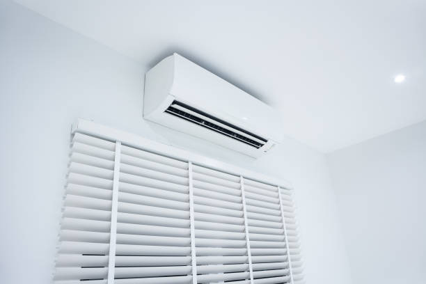 istock Air conditioner and adjusting vertical or venetian blinds. 1354777399