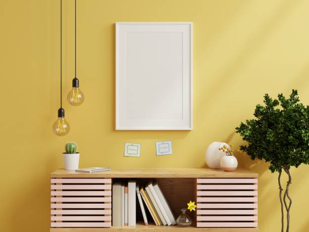 istock Mockup frame on cabinet in living room interior on empty yellow wall background. 1354785682