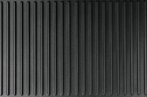 istock The ribbed surface of the electric grill. 1354801643
