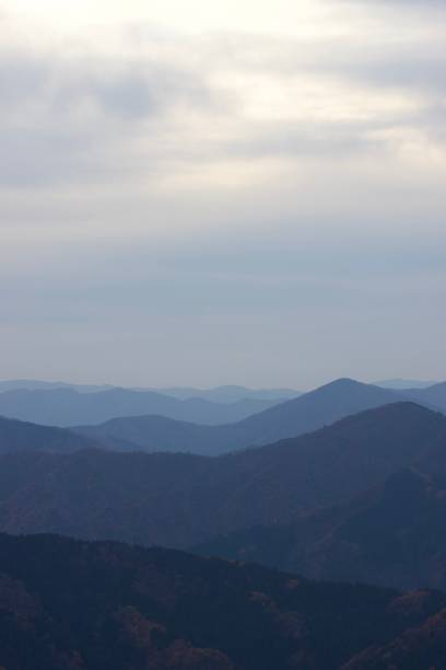 istock mountain silhouettes at dusk 1354801750