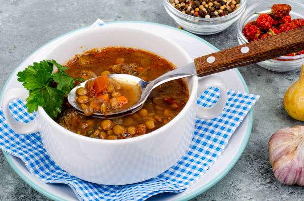 istock Vegetable soup with lentils in white plate. Studio Photo 1354803009