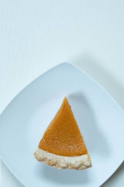 istock Vertical plane of pumpkin pie slice 1354803277