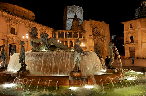 Valencia's main square with fountain at night, Spain