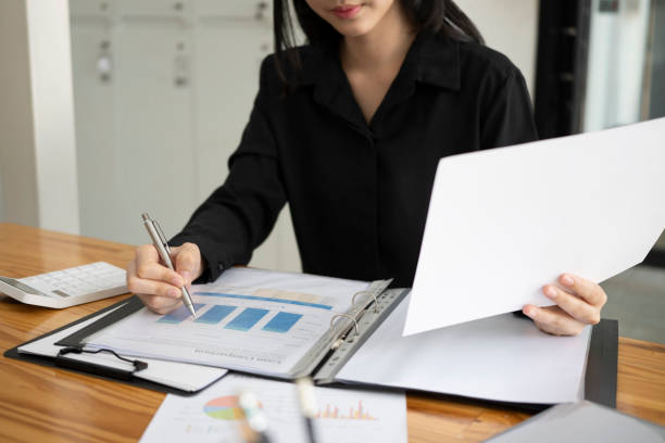 istock Female accountant analyzing financial reports at office. 1354806123