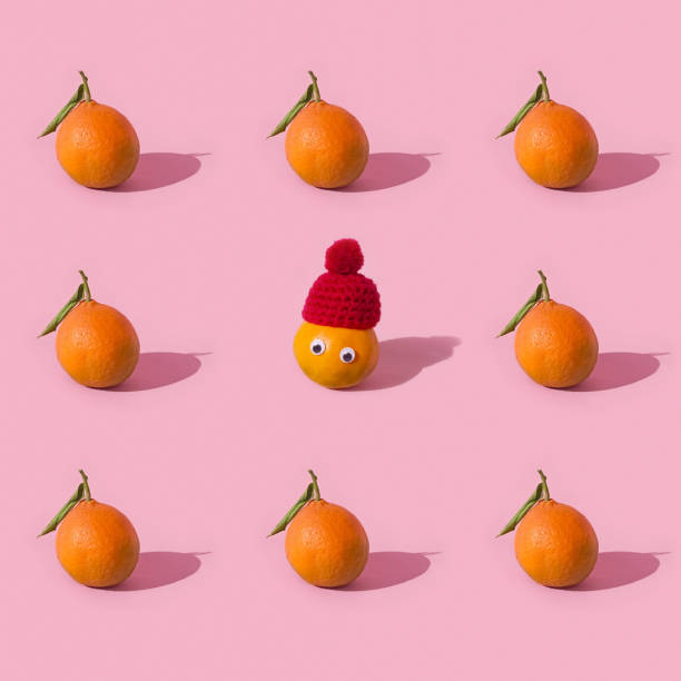 Fruit seamless pattern of fresh tangerine on pink background stock photo