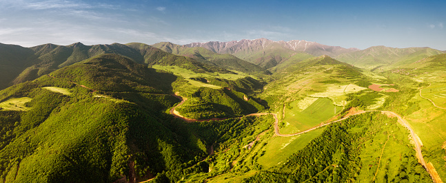Aerial view over lush forests and thickets in the Caucasus Mountains in Armenia near the Tatev Monastery