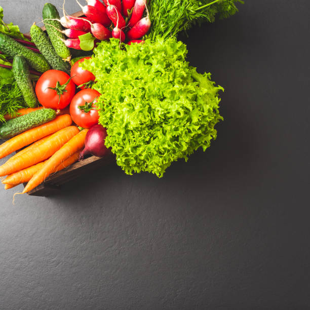 istock Fresh vegetables on wooden table 1354814283