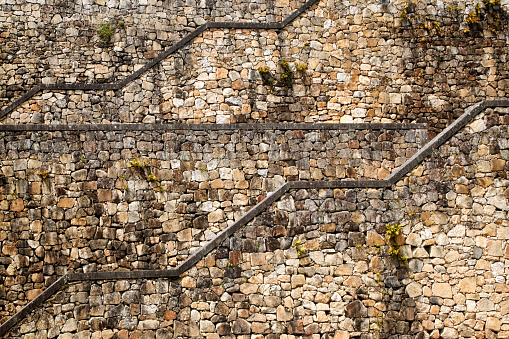 Stone blocks staircase, stone wall, full frame side view.  Tui,   Pontevedra province, Galicia, Spain.