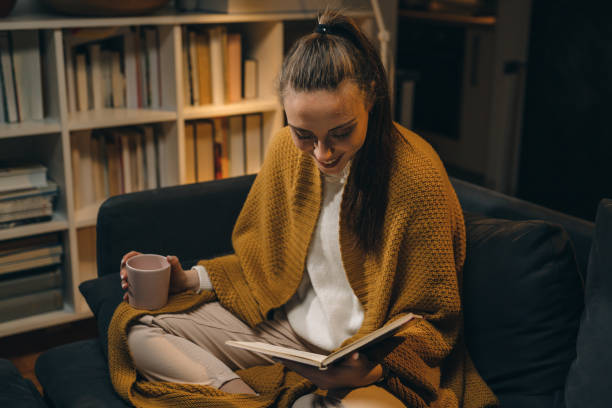 istock woman relaxing at her home late night 1354816150