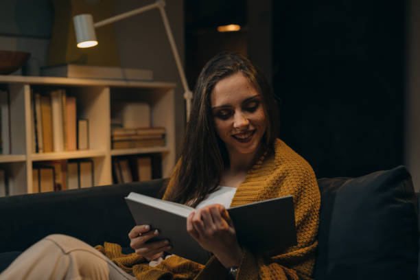 istock woman relaxing at her home late night 1354816157