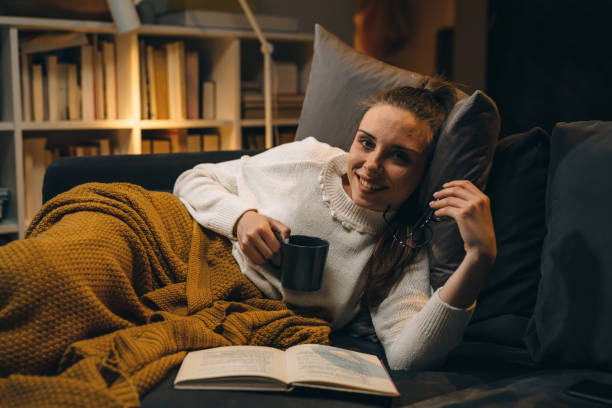 istock woman relaxing at her home late night 1354816165