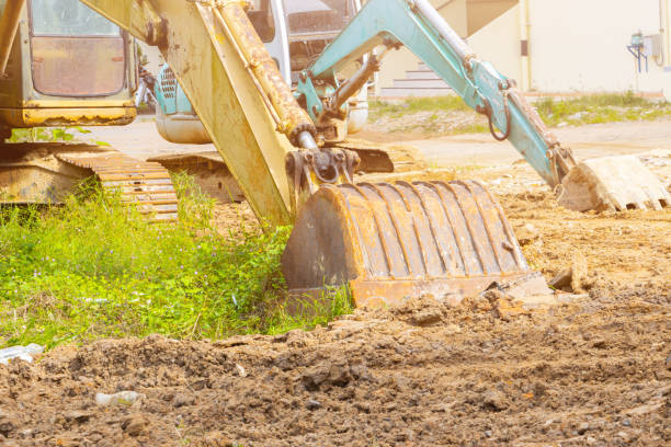istock bucket of excavator on ground in construction site 1354817999