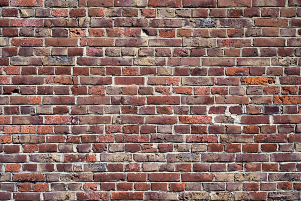 istock High resolution texture of old grungy and weathered brick wall. 1354818033