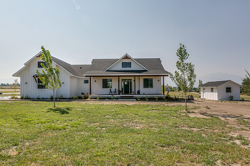 Smaller white modern farmhouse in Montana