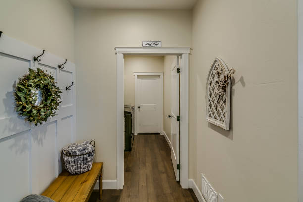 istock Wood flooring and wood bench in otherwise white space 1354819320